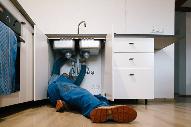 Professional Emergency Plumber technician working in Pinehurst, MA